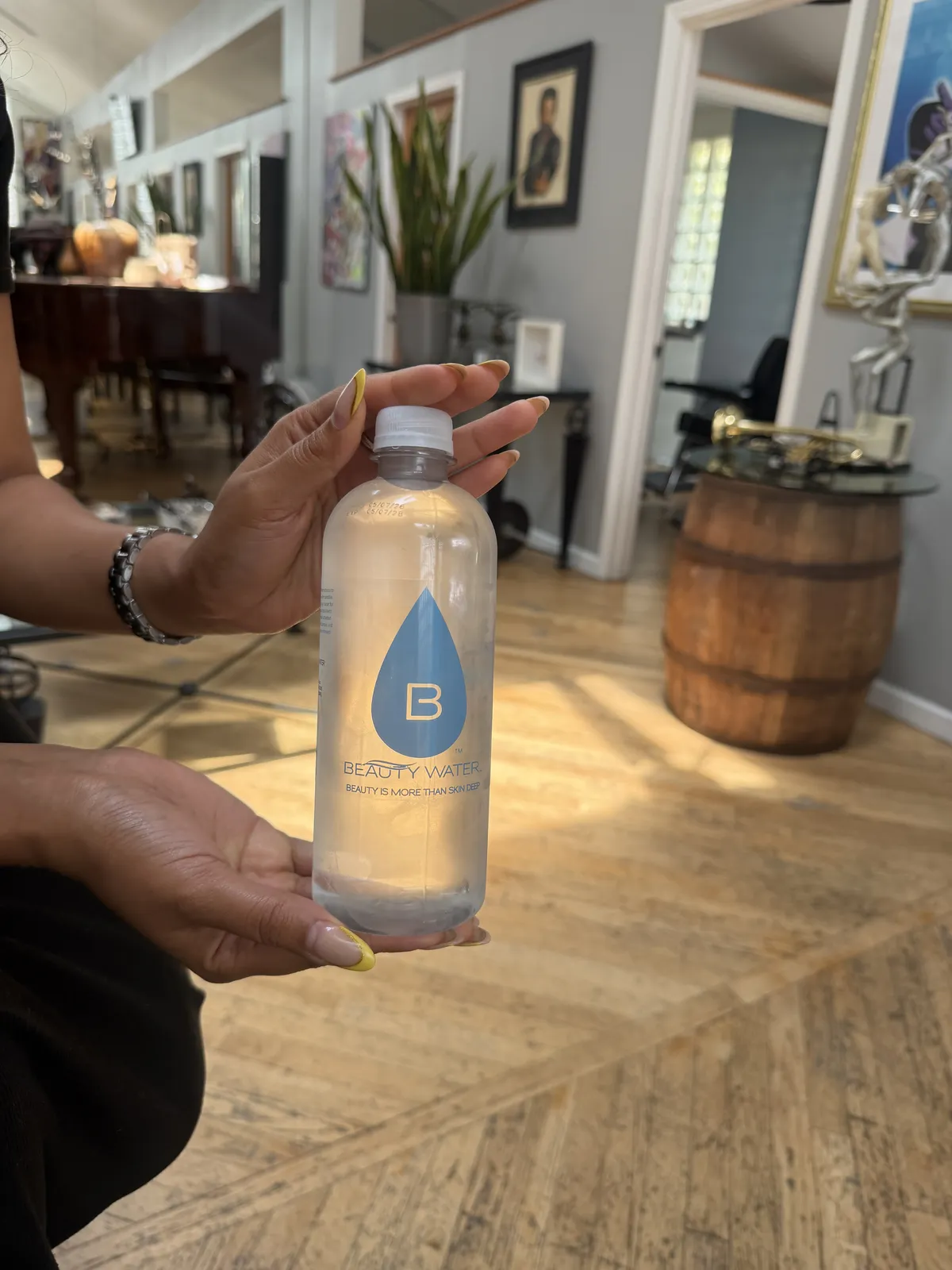 A Beauty Water customer with their bottle
