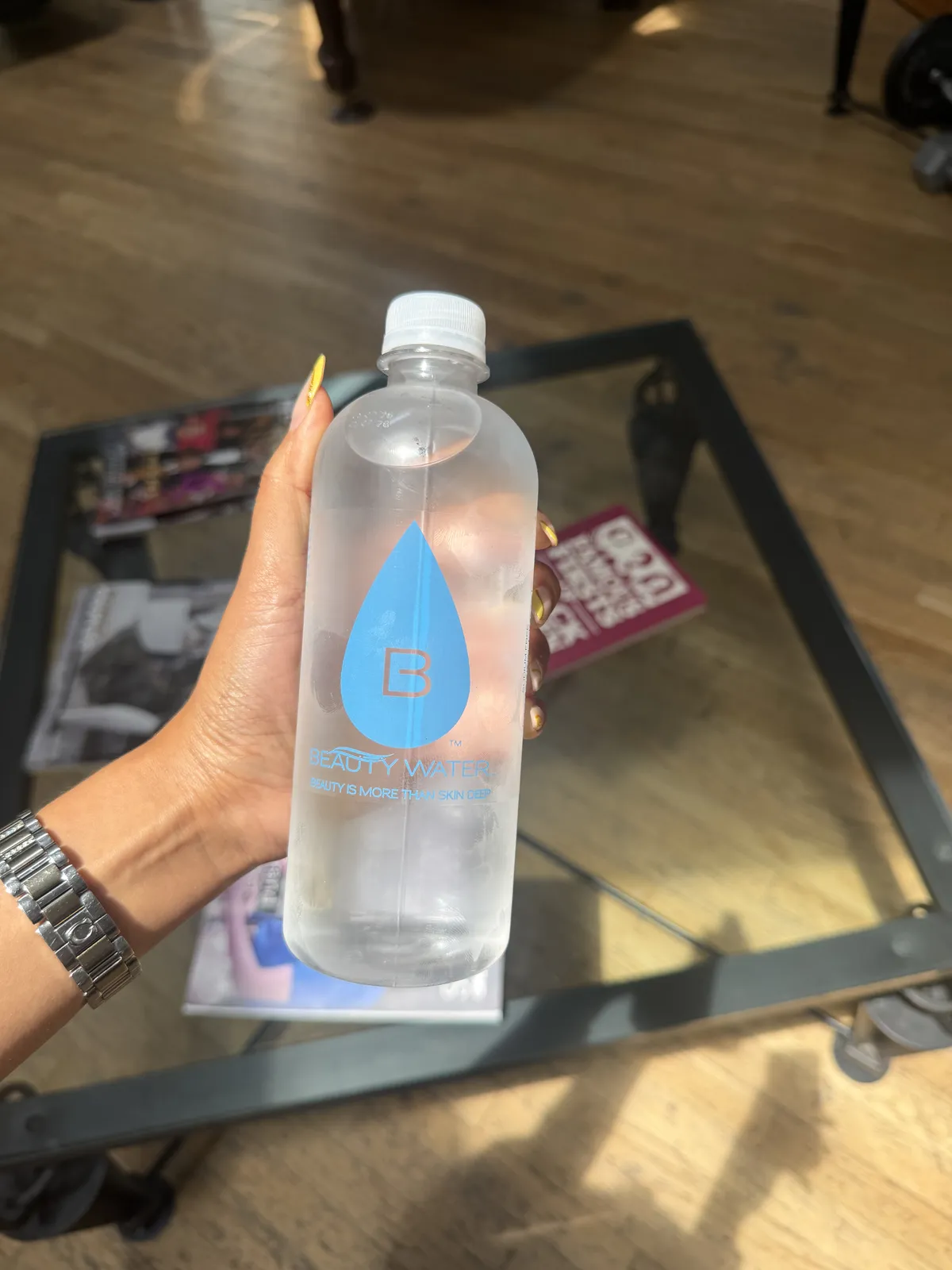 A Beauty Water customer with their bottle